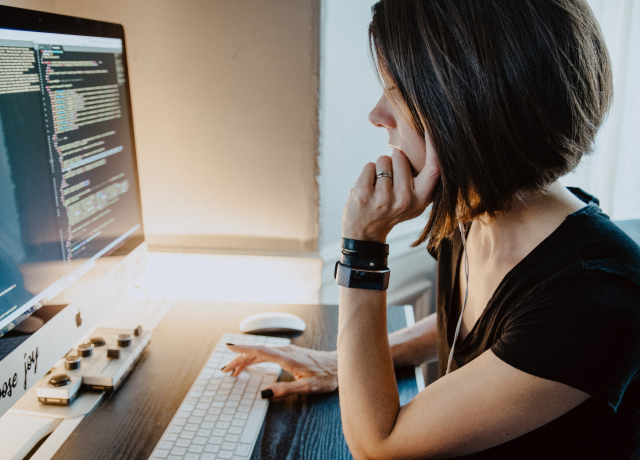 Person looking at code on computer screen